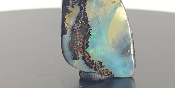 Stunning blues and greens amongst Ironstone. Queensland Boulder Opal from Australia.