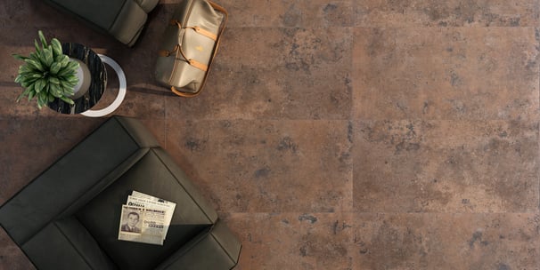 a living room with a couch and a plant