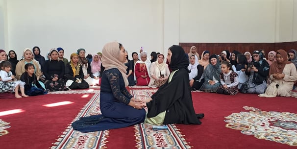 Shahada. A woman accepting Islam in the Imam Malik Mosque Mexico