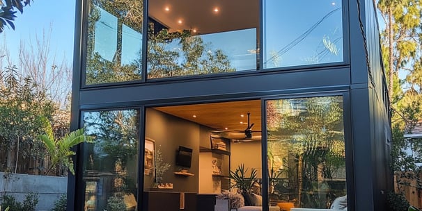 ADU with a glass wall and a patio table