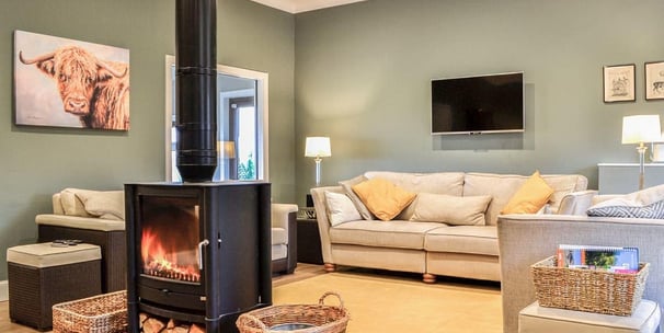 Comfortable lounge with logburner and sofas