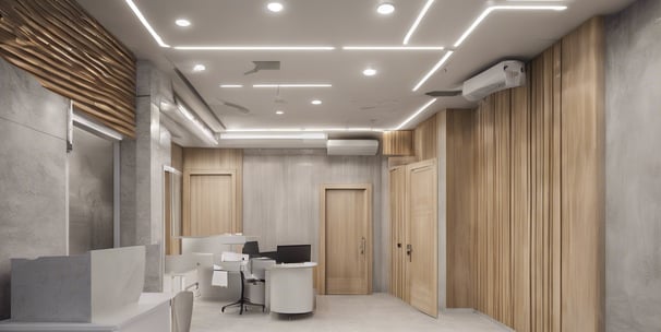 a dental room with a chair and a monitor