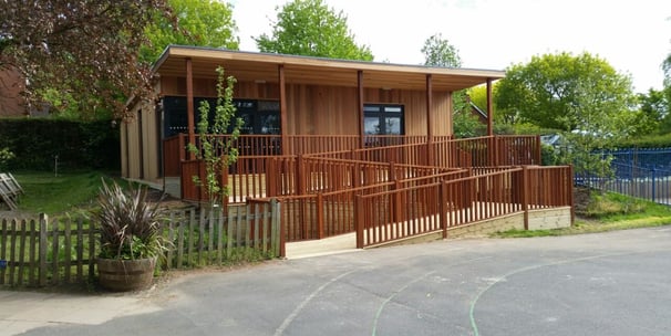 garden room for school with decking and balutrade