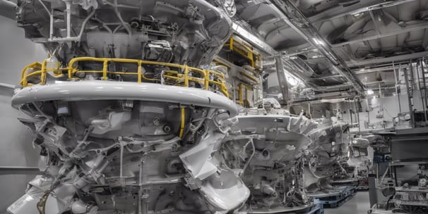 white and orange cargo ship with metal lifting equipment