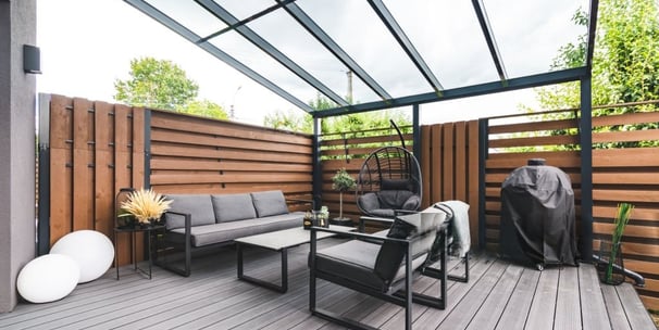 Modern custom deck with pergola and seating in outdoor living space in London Ontario