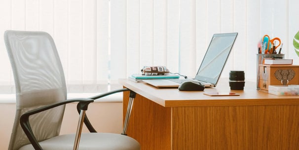 office desk with chair and laptop