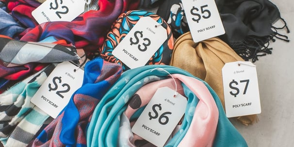 A photo of a variety of polyester scarves with affordable pricing