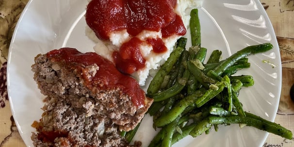 a meatloaf dinner on a plate