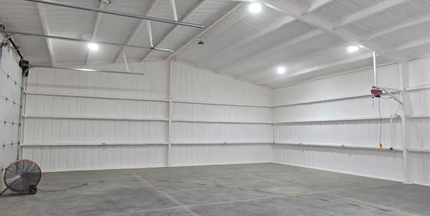 open cell spray foam insulation inside a barn in lakewood, colorado