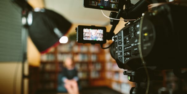 Indoor film shoot with professional camera recording a scene