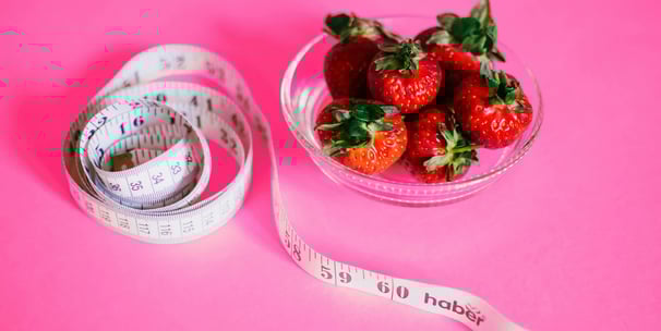 a bowl of strawberries and measuring tape measure tape measure tape measure tape measure tape
