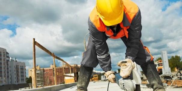a construction worker is working on a roof top