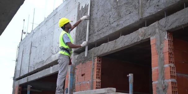 a construction worker is working on a building