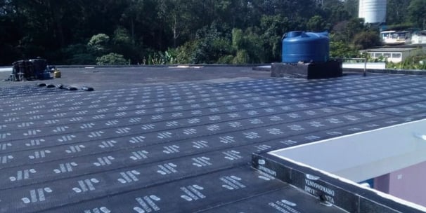 a roof with a blue skylight and a blue skylight
