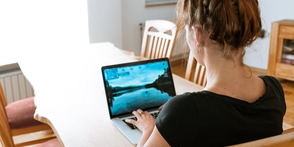 Woman at computer screen at home office