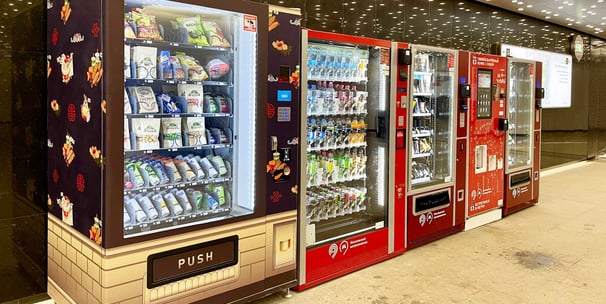 a row of vending machines in a store