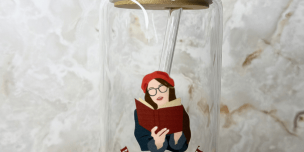 a glass jar with a straw and a straw in it for book lovers and readers 