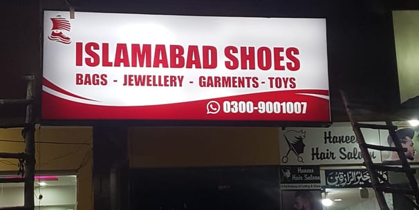 a sign for a shoe shop in a store