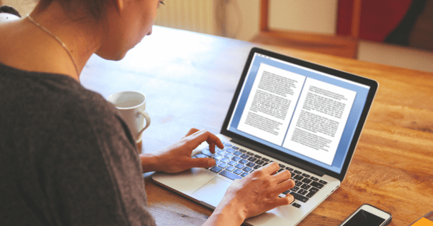 A woman editing a document on a laptop