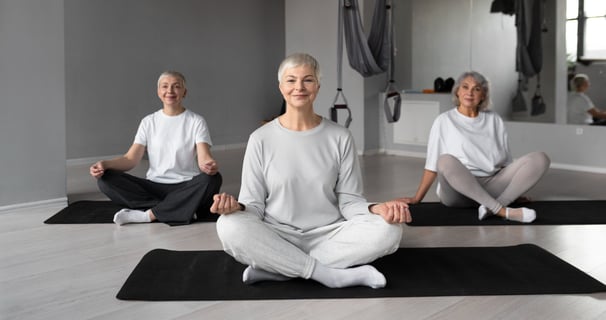 an image of a senior citizen doing yoga 