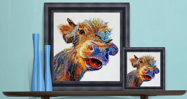 Two sizes of Hattie the happy cow in black frames