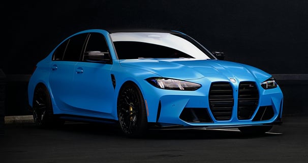 Electric blue BMW M3 Competition XDrive car photography at 704 Exotics in Charlotte, North Carolina.