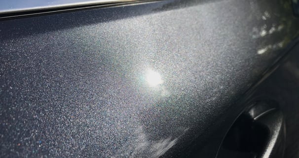 a car with a shiny silver paint job
