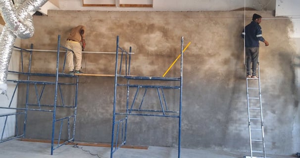 Belair Mall wall reconfiguration – interior plastering and scaffold work during renovation phase.