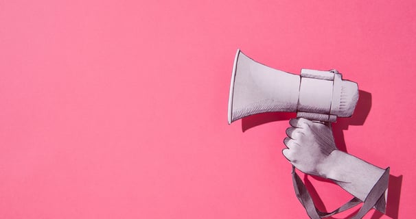a person holding a megaphone in their hand