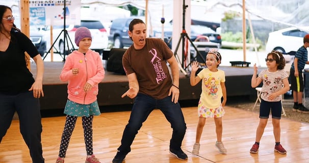 Mekhael Srour and his students dancing