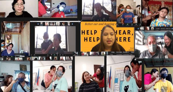 a group of people are gathered around a video conference