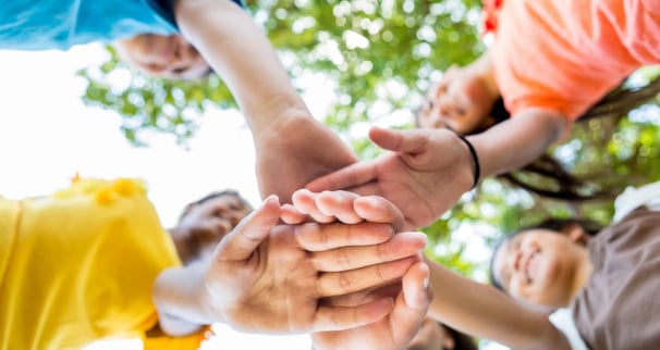 Kids stacking hands