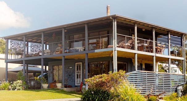 a house wooden with a large deck