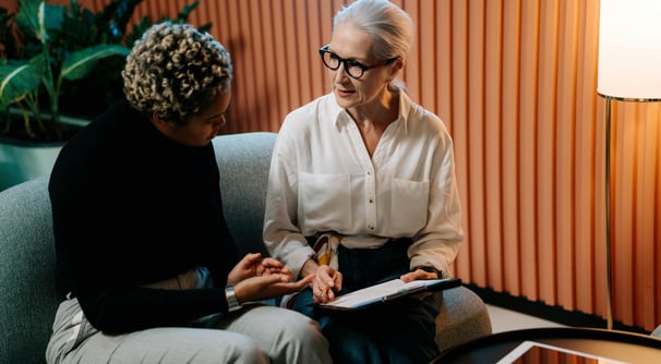 insurance agent shows info to a client