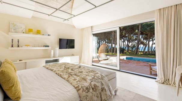 Guest room in the guest house of Villa El Rincon, Marbella, featuring stunning garden and sea views.