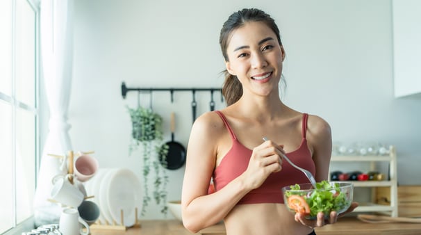 a woman in a red bra top and black bra top