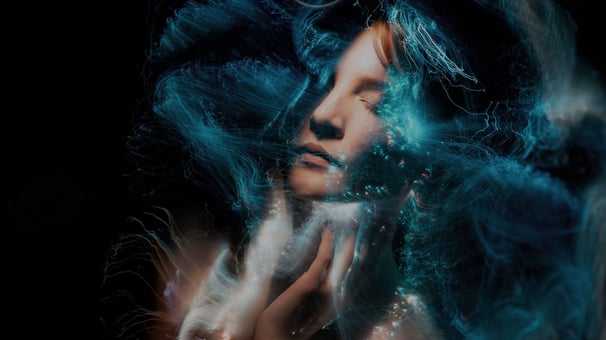 A digital artwork of a woman's face blended with abstract light effects, showcasing Photoshop for artistic expression.