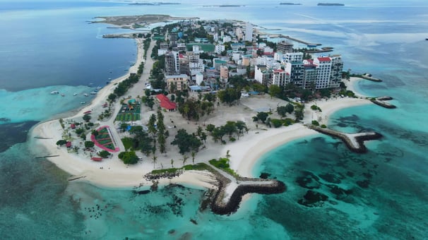 a small island with a small island in the middle of the ocean