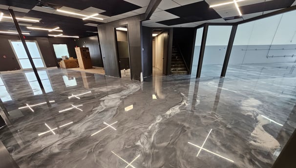 Silver and white metallic epoxy flooring in a showroom 