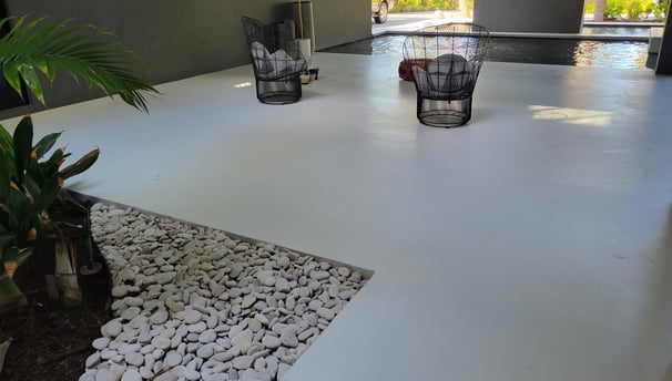 white polyaspartic topcoat in matte finish applied on exterior concrete breezeway