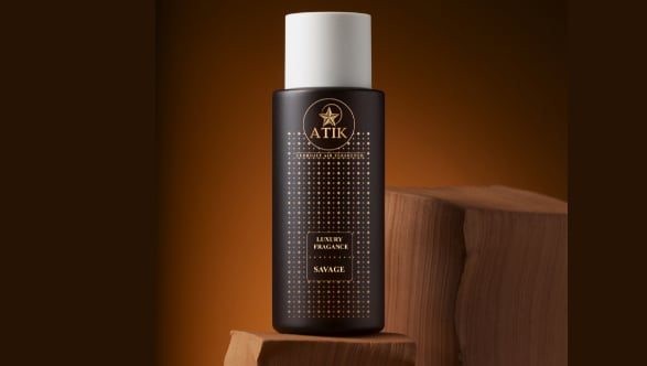 a bottle of atik air fresheners on a wooden block