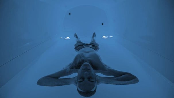 a man in a zero gravity floatation tub 