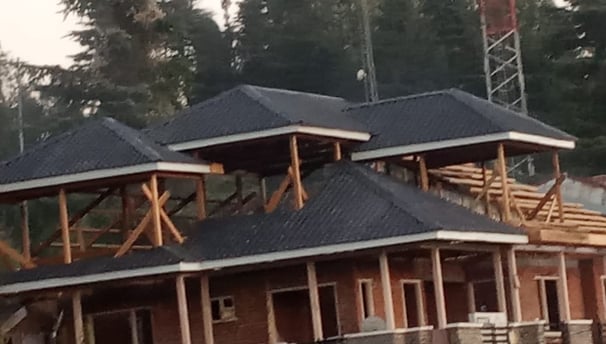 Construction of home stays 2nd and 3rd floor with wooden truss by escotten infra projects pvt. ltd.
