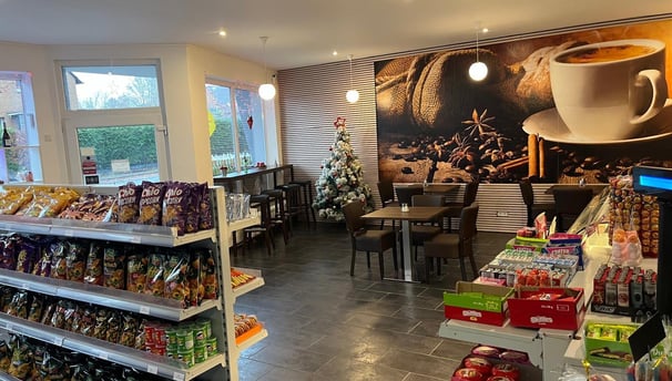 a coffee shop with a coffee shopperfection