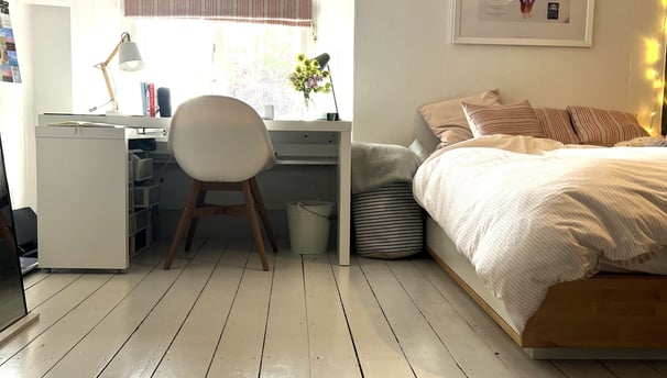 Bedroom with hand painted floorboards