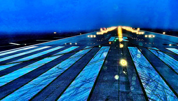 a plane taking off from the runway at night