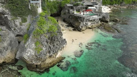 Nestled under Uluwatu’s cliffs, Suluban Beach