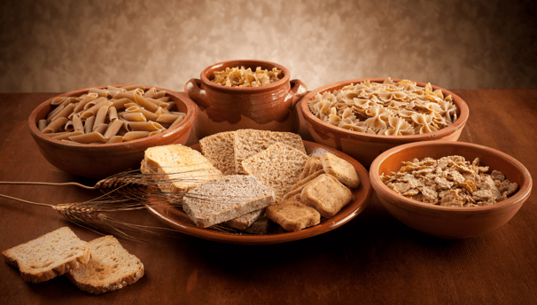 a table with bowls of food and bread