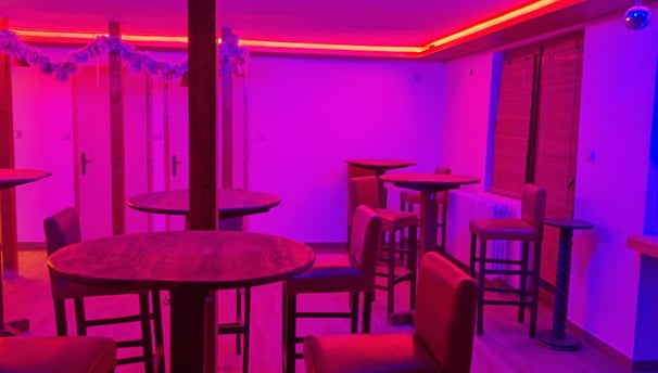 a bar with a purple light and a purple light
