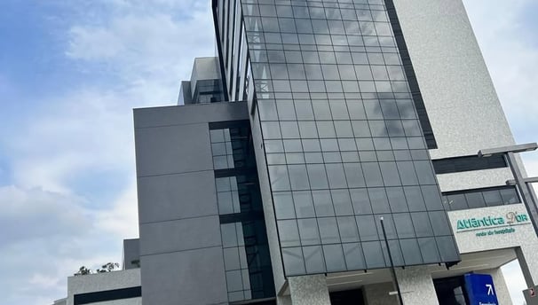 a large building with a sign that says, the building is a tall building